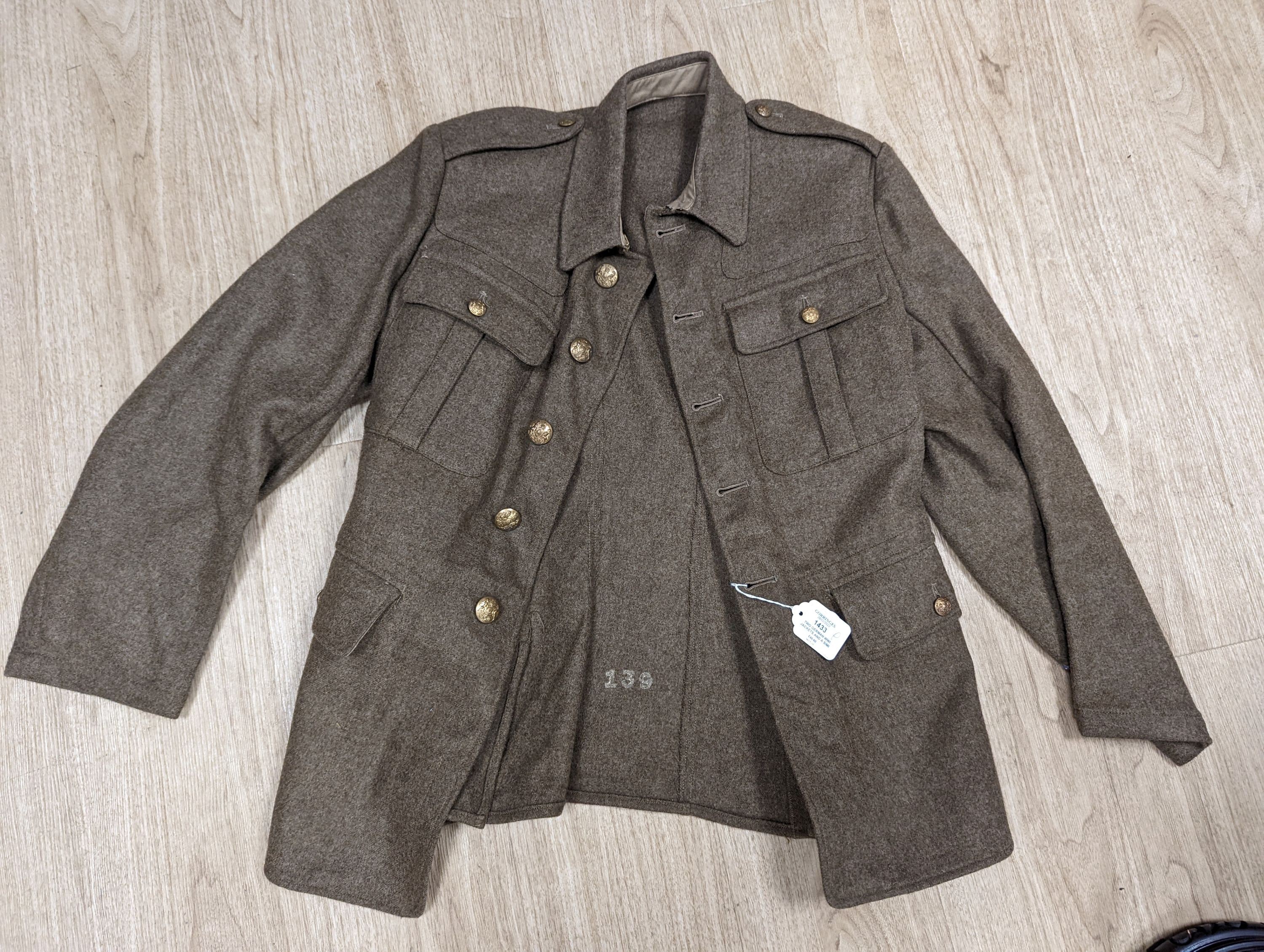 Two German WWI jackets and a similar British jacket.